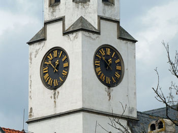 Low angle view of clock tower against sky