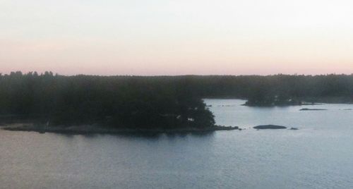 Scenic view of calm lake against clear sky