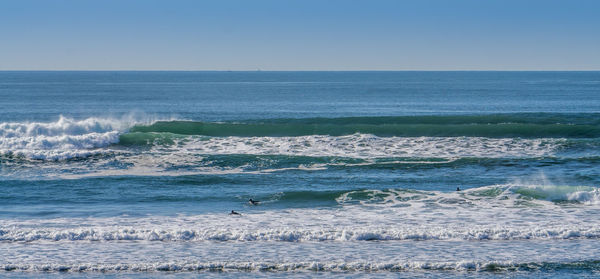 Waves suitable for surfing roll in at westport, washington.