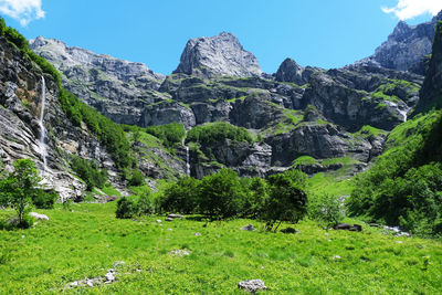 Scenic view of landscape and mountains against sky