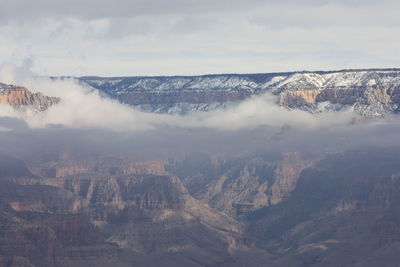 Aerial view of landscape with mountain range in background