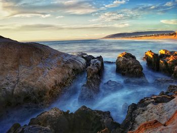 Scenic view of sea against sky during sunset