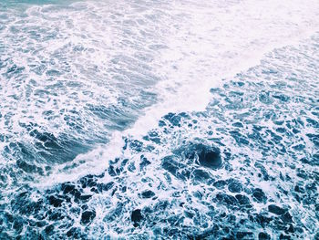 High angle view of waves on shore