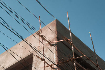 Low angle view of building against clear blue sky