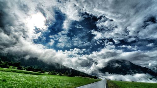 Scenic view of landscape against cloudy sky