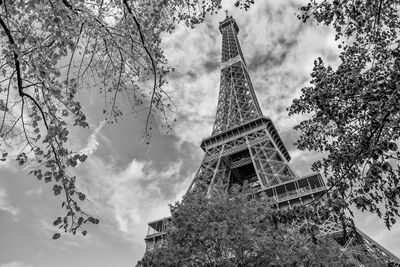 Low angle view of tower against cloudy sky