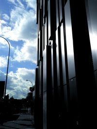 Low angle view of building against cloudy sky