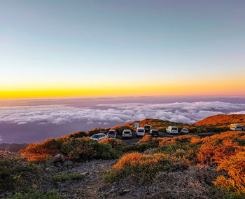 Cars park  on a cliff at la palmas highest mountain to enjoy the sunset