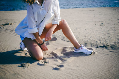 Low section of woman on beach