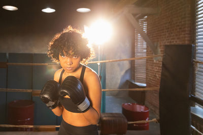 Young woman exercising in gym