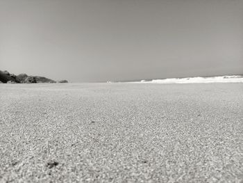 Scenic view of beach against clear sky