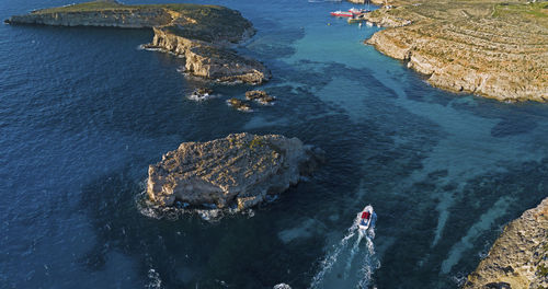 Aerial view of boat sailing in sea