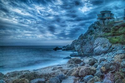 Scenic view of sea against cloudy sky