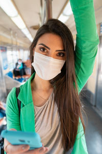 Portrait of a beautiful young woman wearing mask