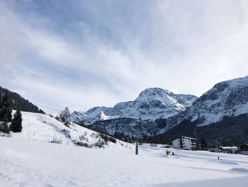 Scenic view of snowcapped mountains against sky