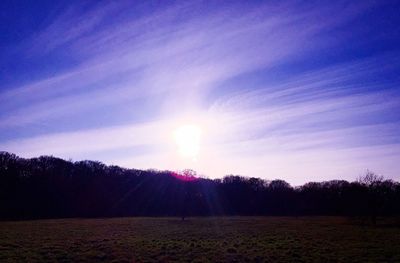 Scenic view of landscape against sky at sunset