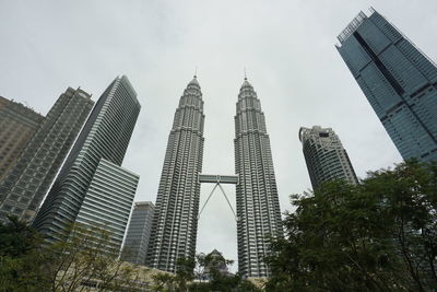 Low angle view of skyscrapers against sky