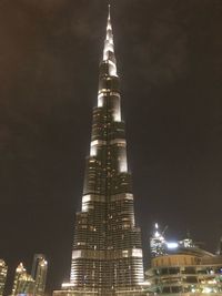 Low angle view of skyscrapers lit up at night