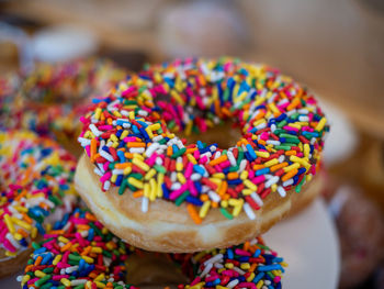 Close-up of multi colored sprinkle donut