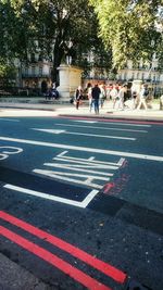 People on road in city