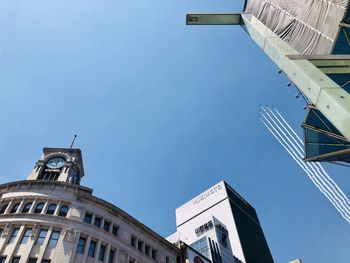 Low angle view of buildings against blue sky