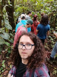 Portrait of young couple kissing in forest