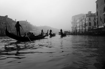 People on boat in canal