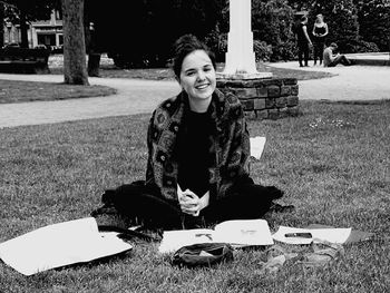 Portrait of girl sitting in park