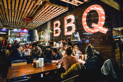 Group of people in restaurant at night