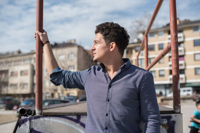 Young man looking away outdoors