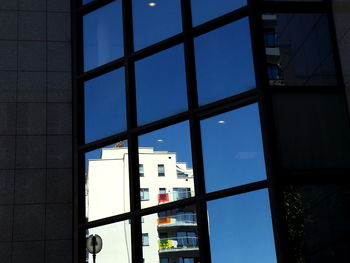 Reflection of buildings on glass window