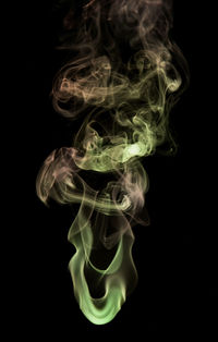 Close-up of smoke against black background