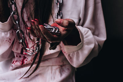 Close-up of woman holding hands