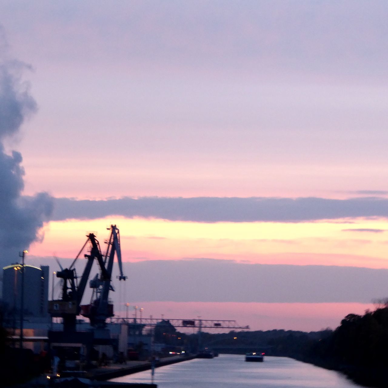 SILHOUETTE OF PIER AT SUNSET