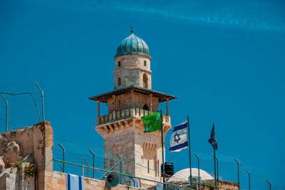 Minaret behind the western wall in jerusalem.