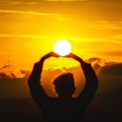 Silhouette of man against sky during sunset