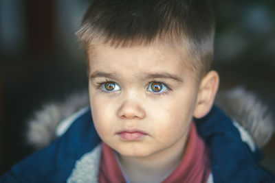 Close-up of boy looking away