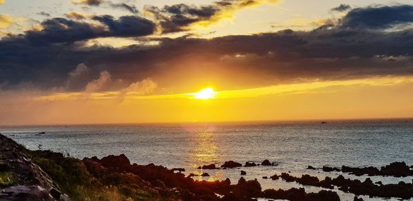 Scenic view of sea against sky during sunset