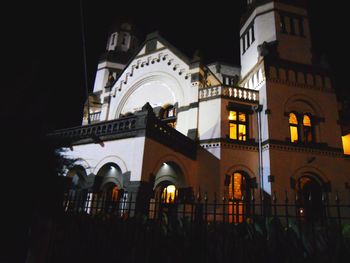 Low angle view of illuminated building at night