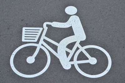 High angle view of bicycle sign on street