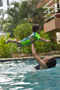 Mother with son in swimming pool