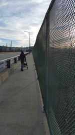 Full length of woman walking on road