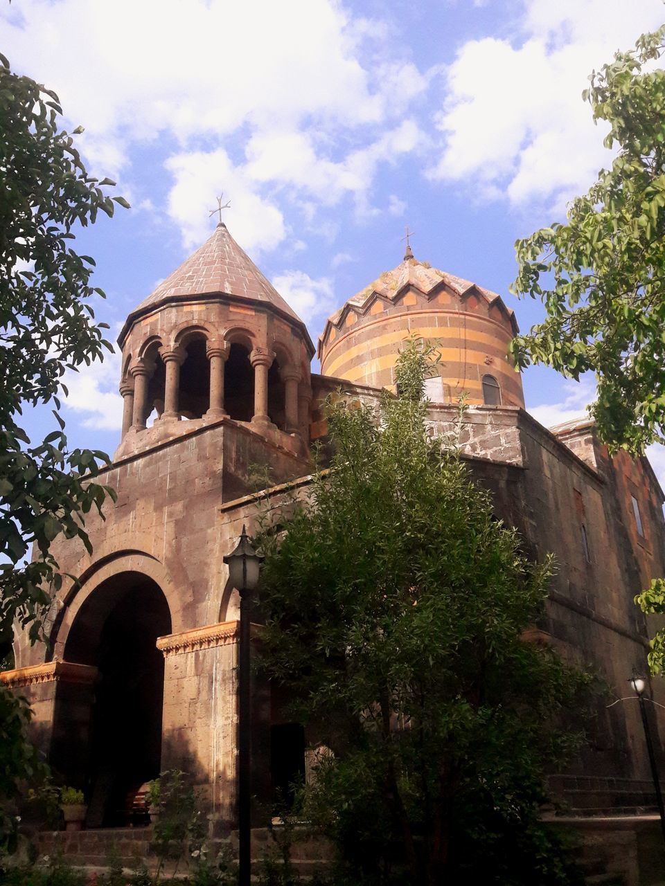 architecture, built structure, building exterior, place of worship, religion, spirituality, sky, tree, day, low angle view, cloud - sky, outdoors, history, no people, dome, travel destinations, bell tower