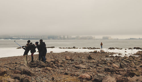 Woman standing on shore