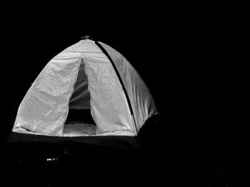 Tent against black background