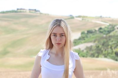 Portrait of teenage girl standing outdoors