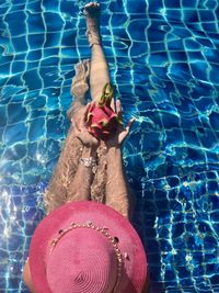 High angle view of woman swimming in pool