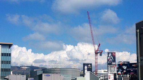 Low angle view of building against cloudy sky