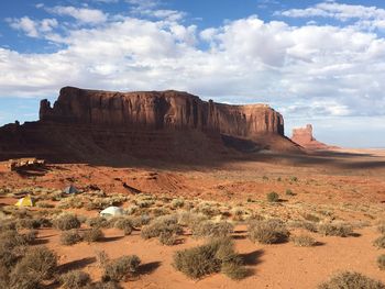 Rock formations on landscape against sky