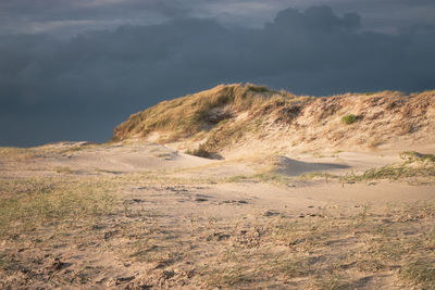 Scenic view of arid landscape against sky